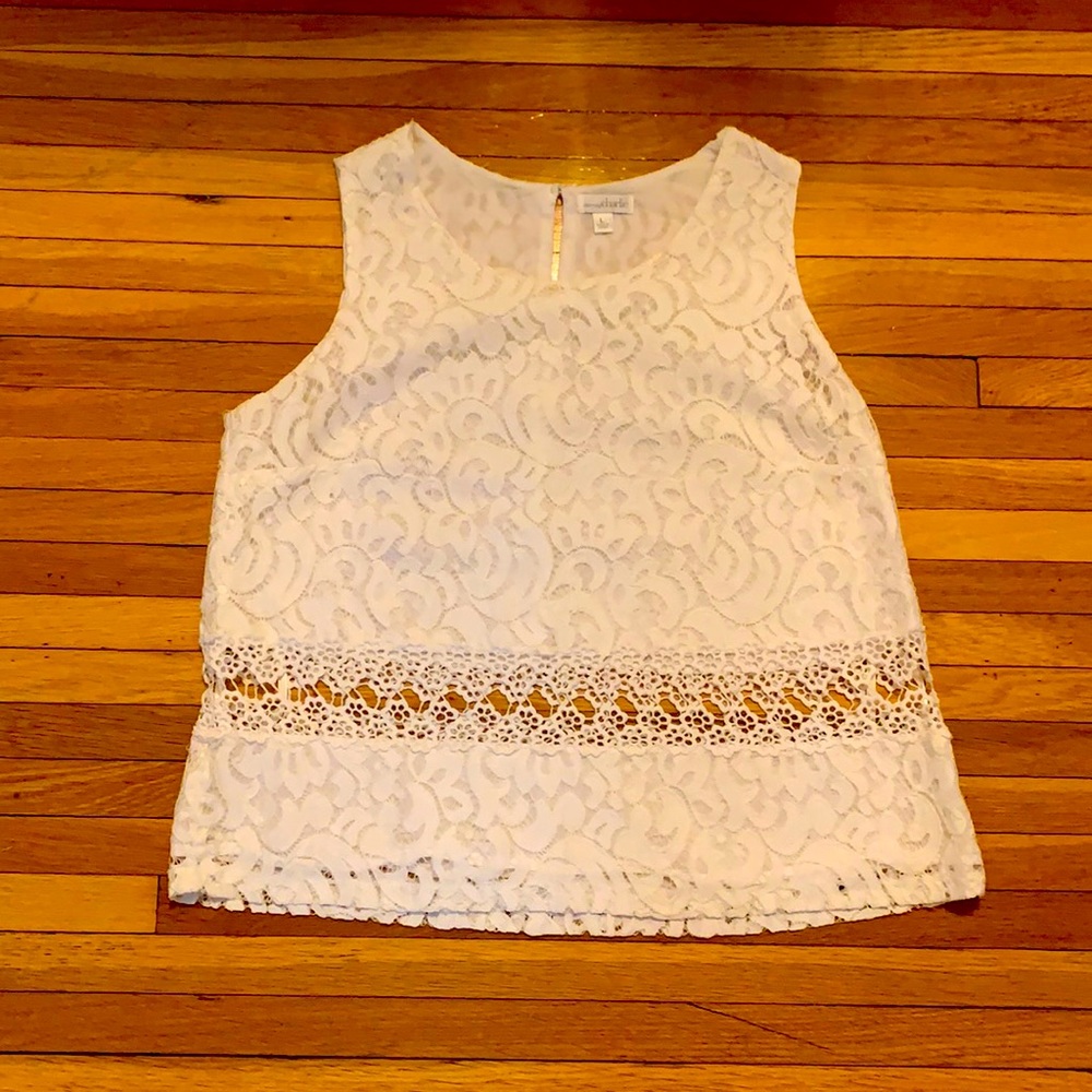 Elegant lace top with cut-outs.